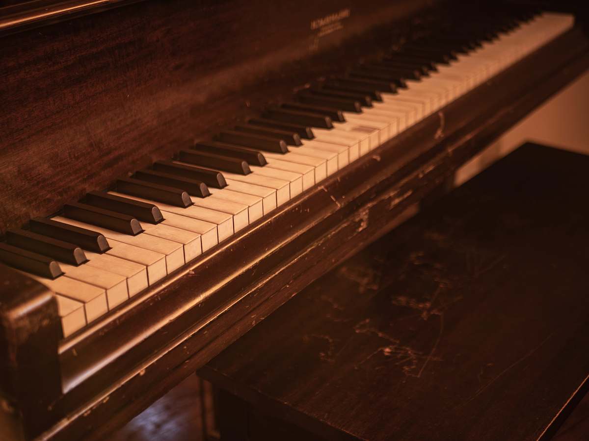 piano closeup photo of upright piano musical instrument